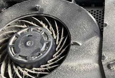 The inside of a very dusty PS4.