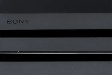 A PS4 Pro console that is turned off, zoomed-in to the front.